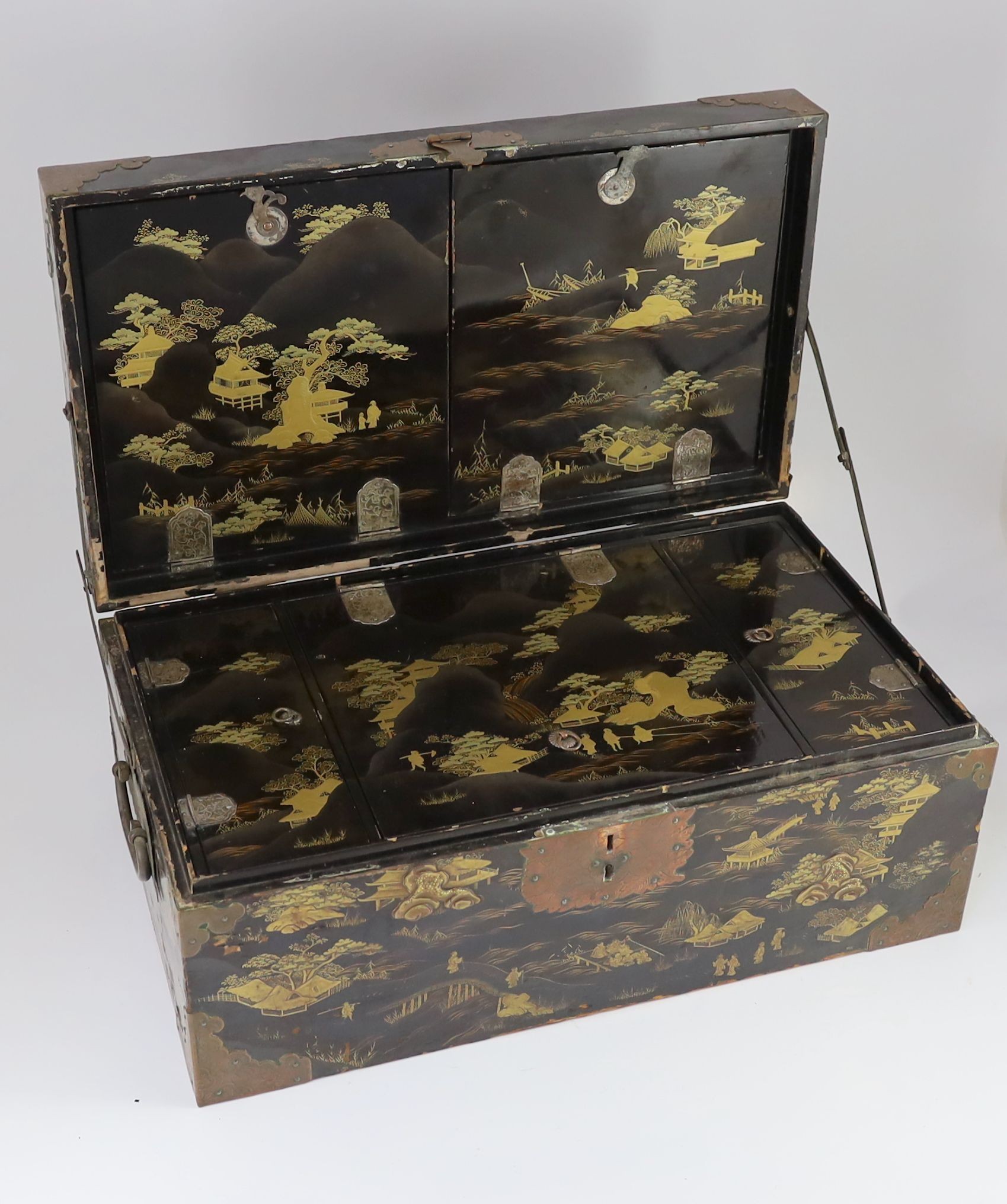 A Japanese lacquer fitted travelling trunk, 19th century, 55cm wide, H 23cm. D 32cm. Some losses to lacquer and wear to mounts